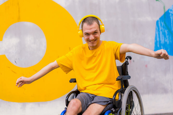 Man using a wheelchair at home